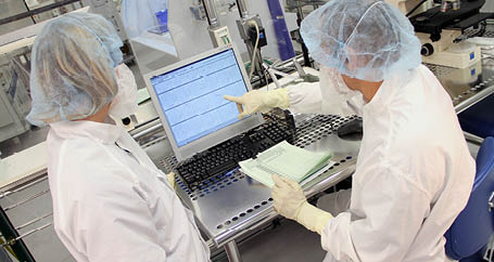 Employees working in a lab at Advanced Engineering Materials (AEM) in Auburn, MI 