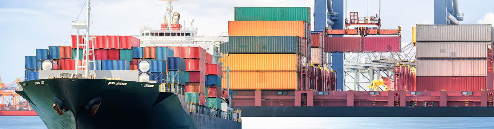 Logistics and transportation of Container Cargo ship with working crane bridge in seaport 