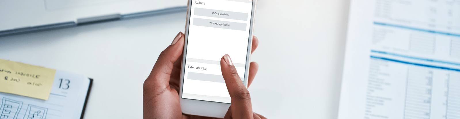 Cropped shot of a businesswoman using a mobile phone at her desk in an office